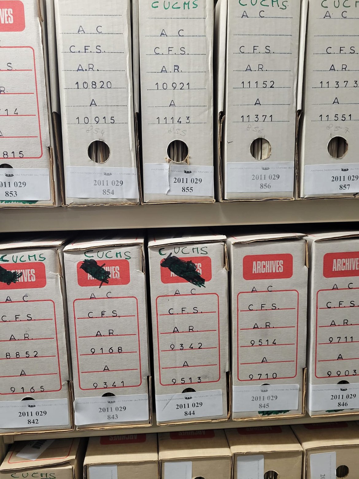Photo of archived files at the French National Archives of the World of Work