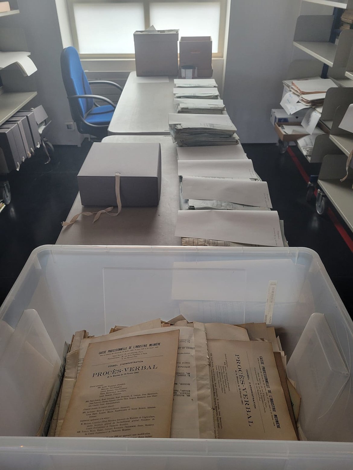 Photo of archived files at the French National Archives of the World of Work
